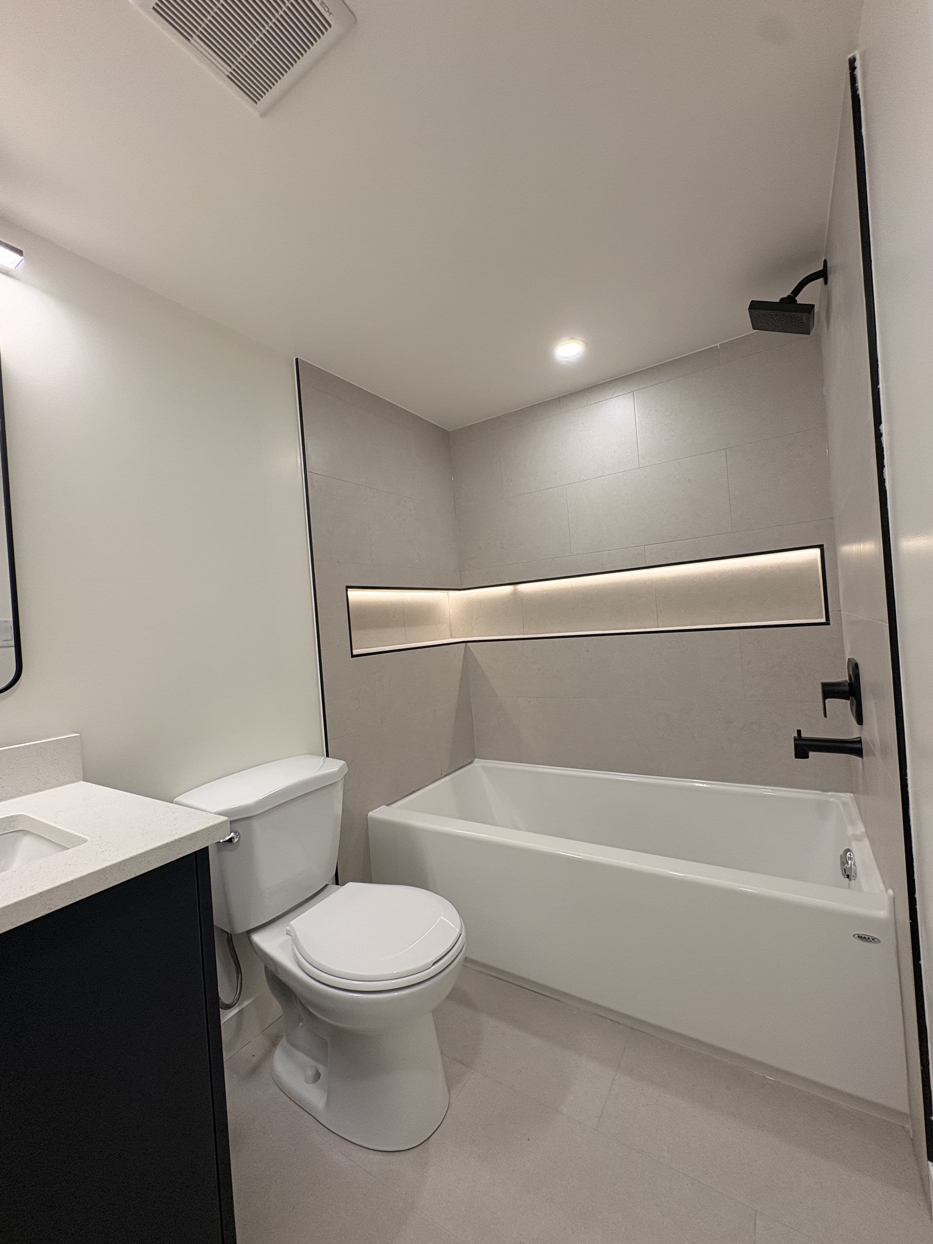 Finished legal suite bathroom with tub and shower
